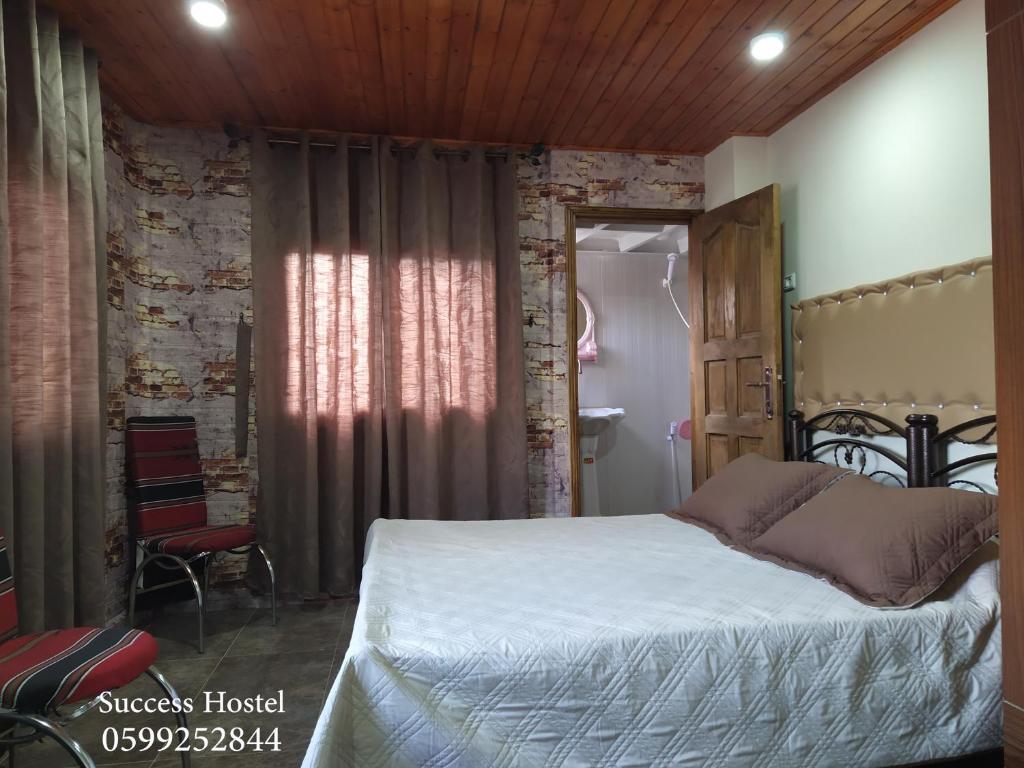 Postel nebo postele na pokoji v ubytování Success Hostel