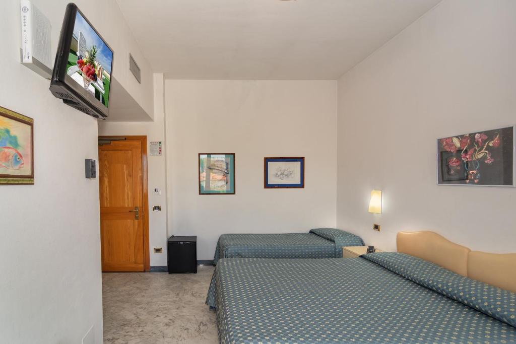 TV a/nebo společenská místnost v ubytování Hotel Mariotti