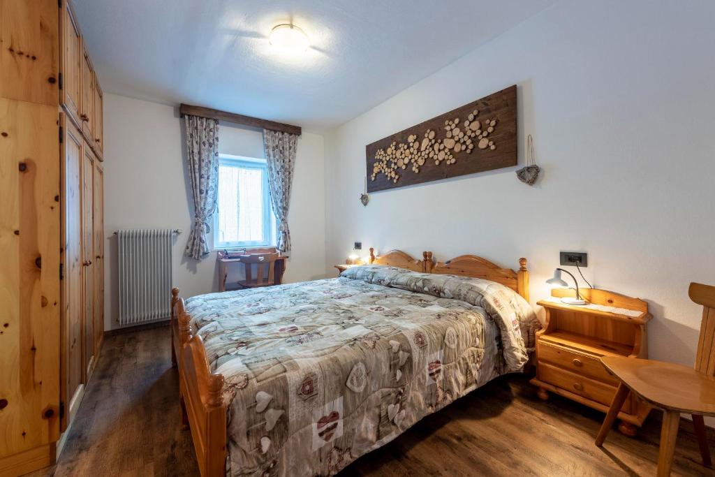 Postel nebo postele na pokoji v ubytování Appartamenti Residence La Roggia