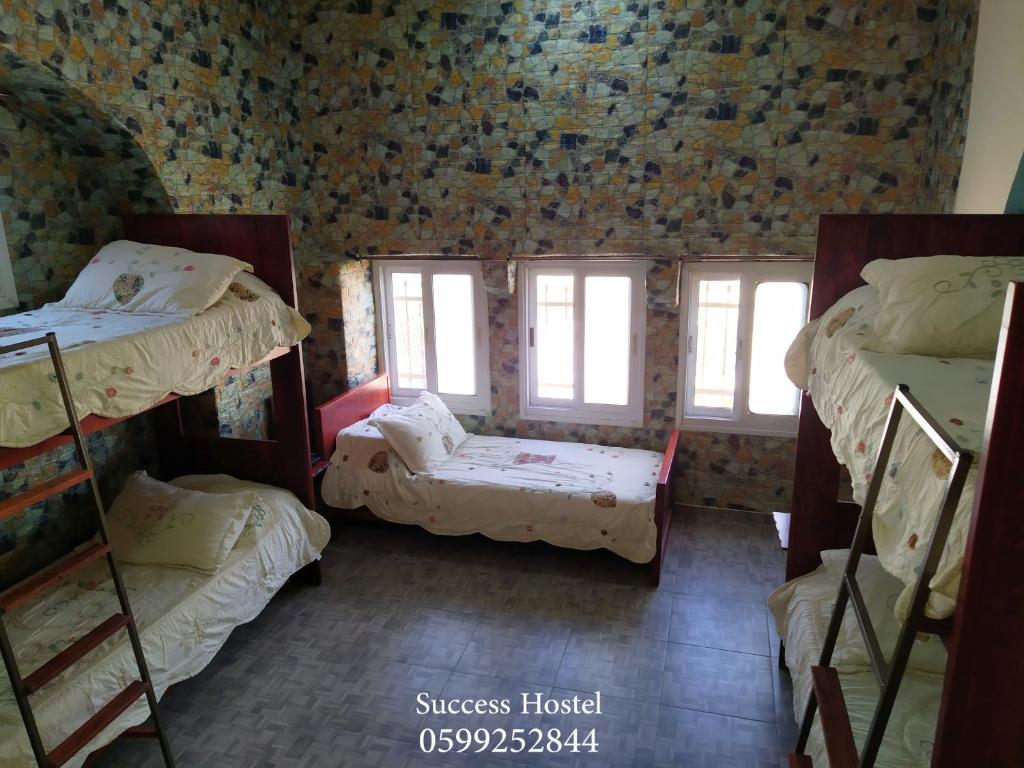 Postel nebo postele na pokoji v ubytování Success Hostel
