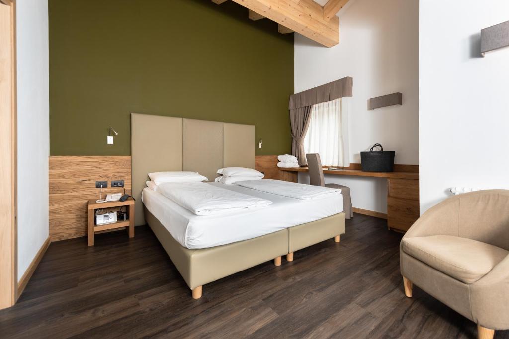 Postel nebo postele na pokoji v ubytování Hotel Valacia