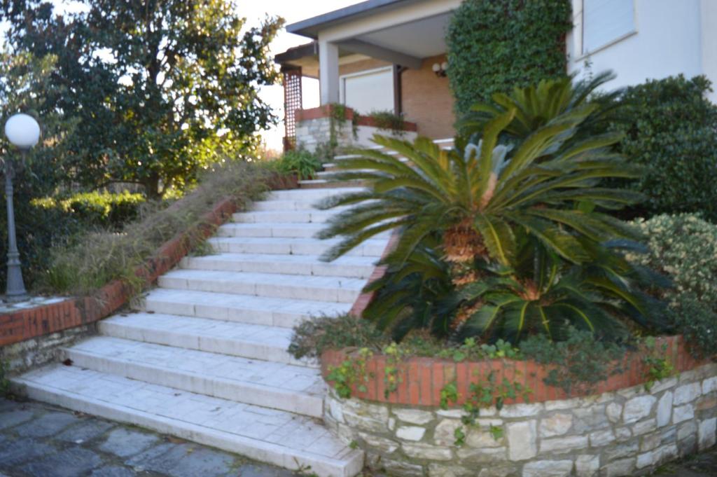 a set of stairs in front of a house at B&B Tra Mare e Marmo in Marina di Carrara
