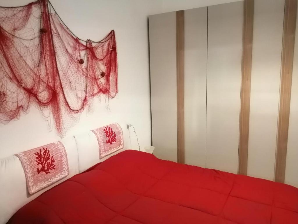 Posteľ alebo postele v izbe v ubytovaní Appartamento corallo