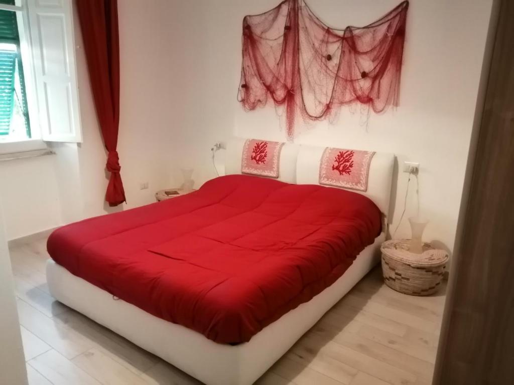 Posteľ alebo postele v izbe v ubytovaní Appartamento corallo