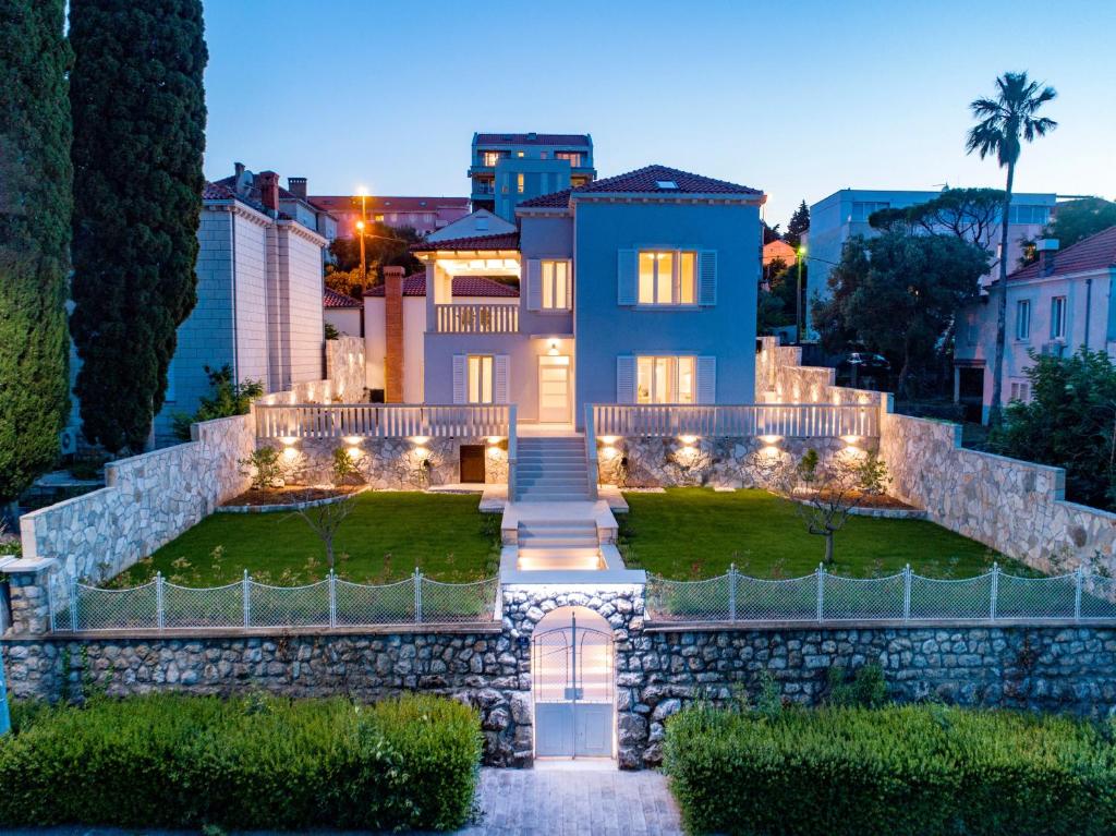 a house with lights on the front of it at Villa Enigma in Dubrovnik