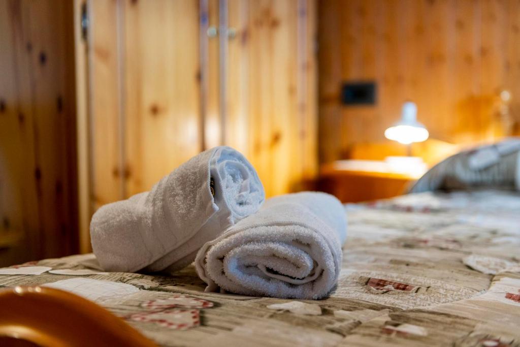 Postel nebo postele na pokoji v ubytování Appartamenti Residence La Roggia