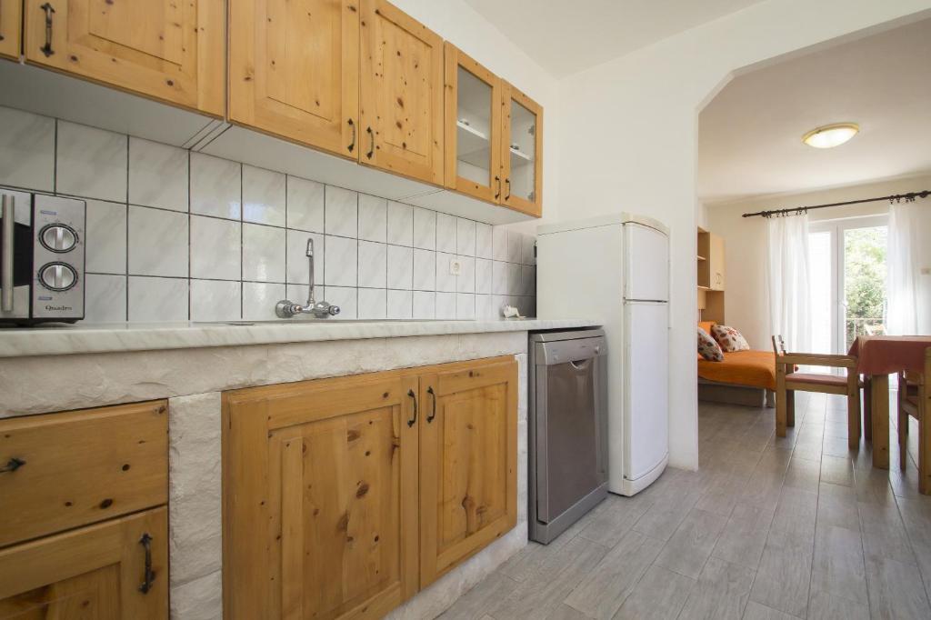 Kuchyň nebo kuchyňský kout v ubytování Seafront Apartment Dana