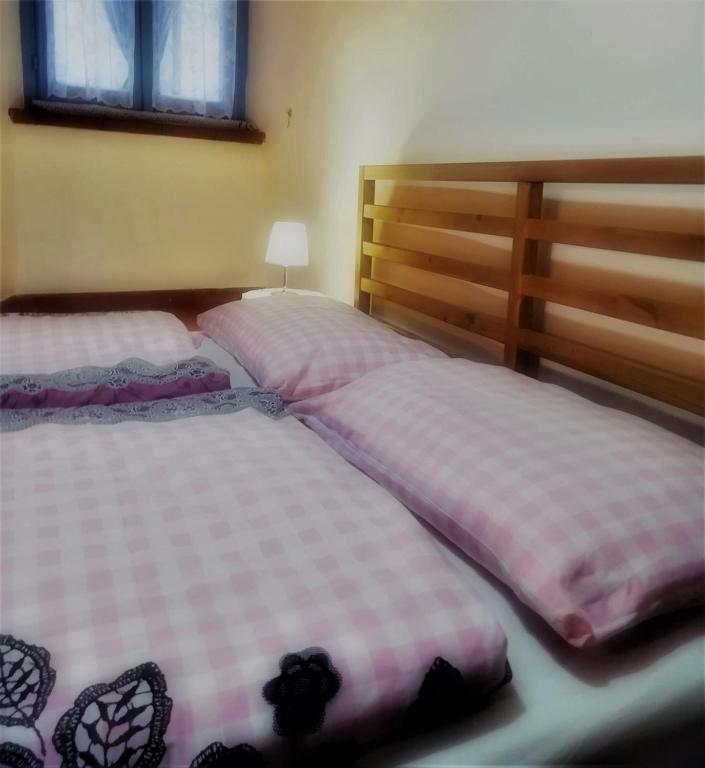 A bed or beds in a room at La Loggetta casa vacanze