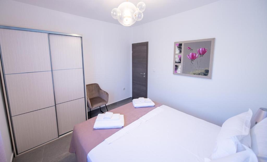 Posteľ alebo postele v izbe v ubytovaní Bella Apartments Zaton