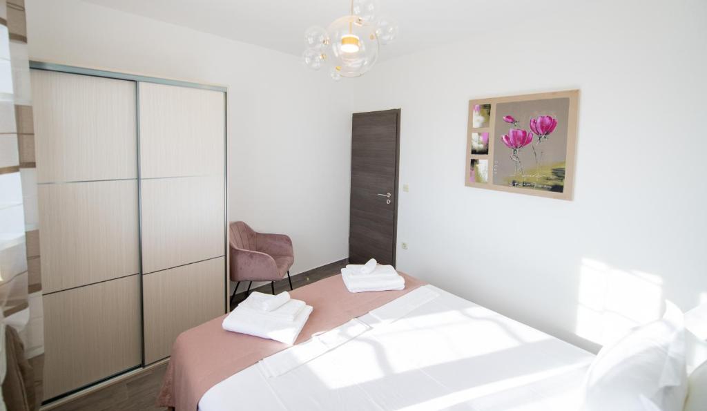 Posteľ alebo postele v izbe v ubytovaní Bella Apartments Zaton