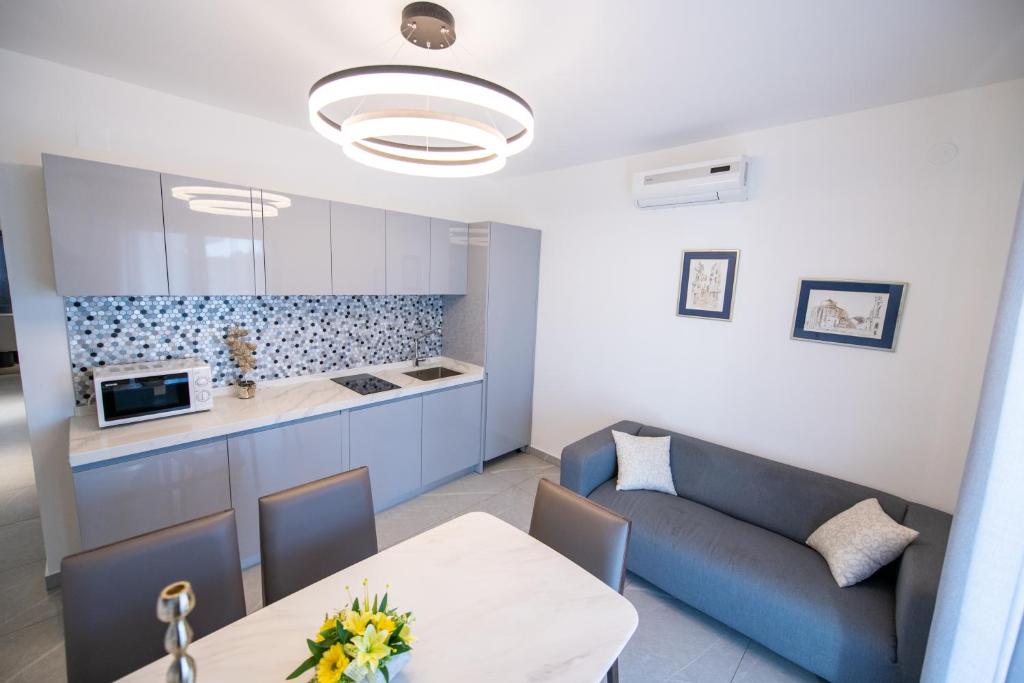 Kuchyňa alebo kuchynka v ubytovaní Bella Apartments Zaton