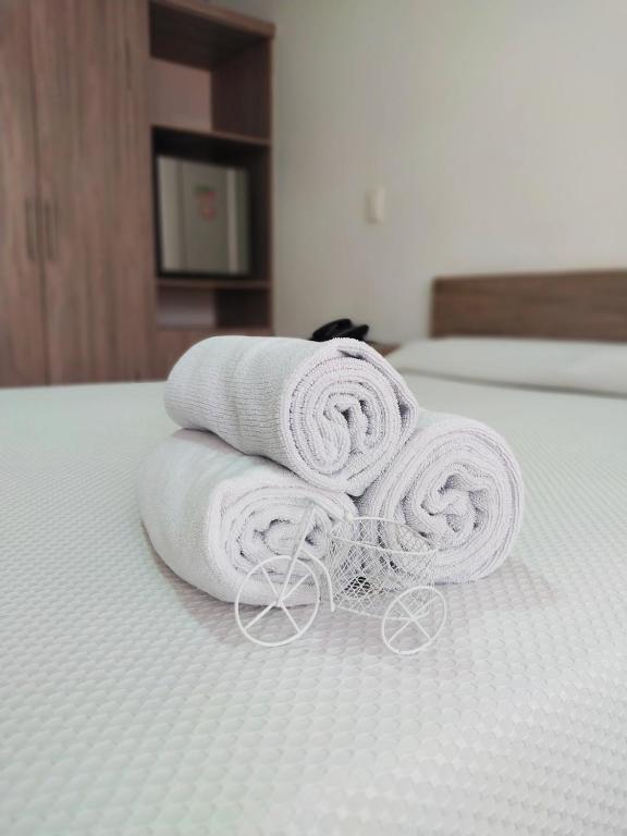 Postel nebo postele na pokoji v ubytování Hotel Barbacoa Uraba