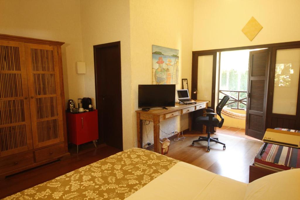 TV/trung tâm giải trí tại Pousada Vila Tamarindo Eco Lodge