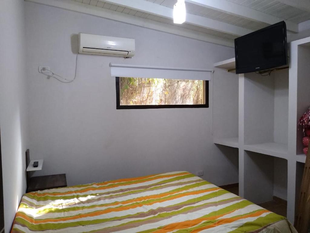 Una cama o camas en una habitación de PROSPERIDAD AZAHAR