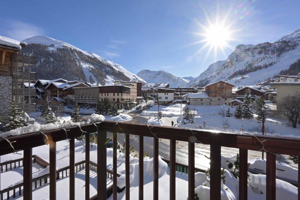 a view from a balcony of a town in the snow at Appartement de charme hyper centre à Val d'Isère in Val-d'Isère