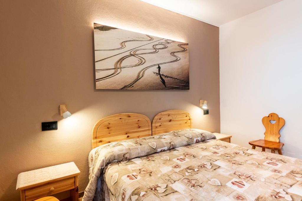 Postel nebo postele na pokoji v ubytování Appartamenti Residence La Roggia