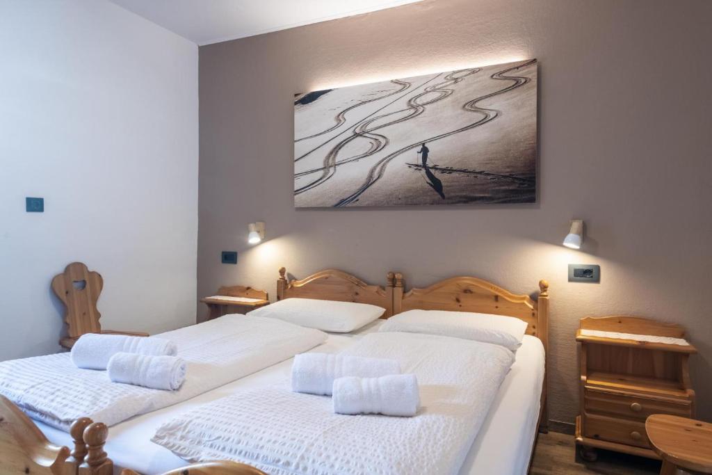 Postel nebo postele na pokoji v ubytování Appartamenti Residence La Roggia