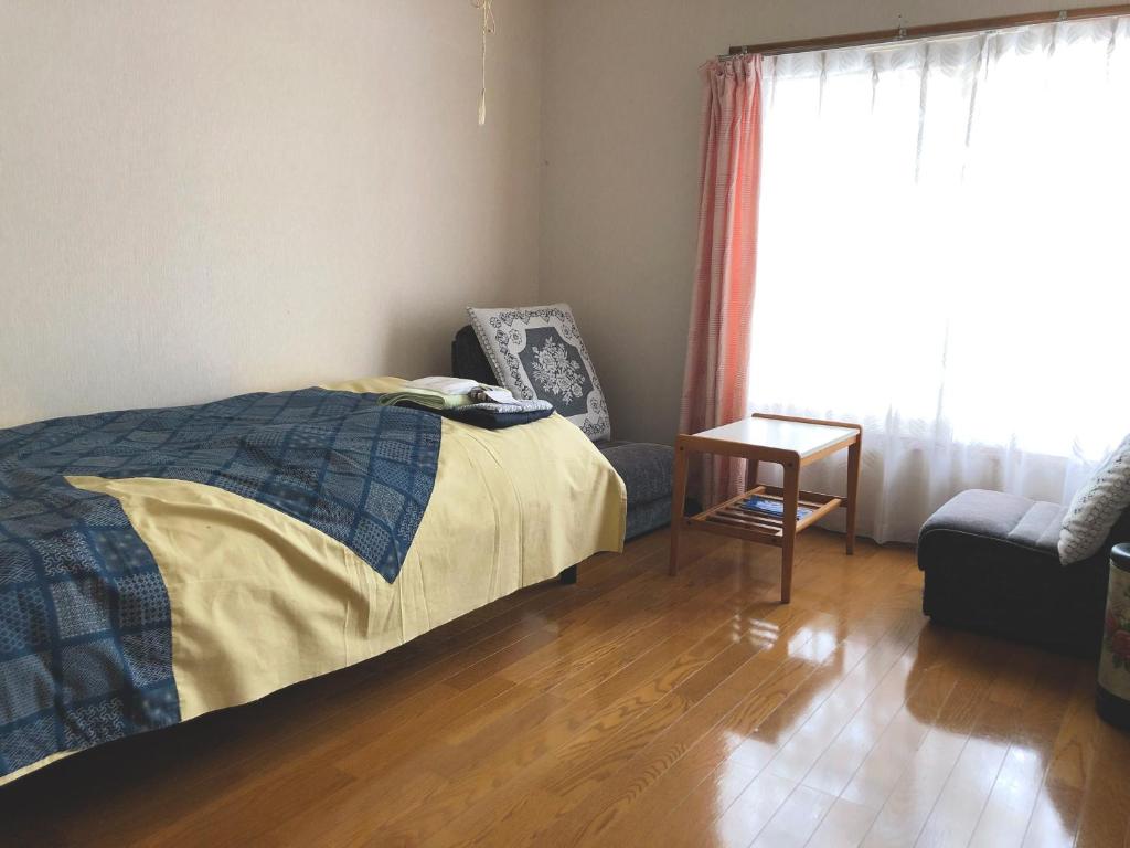 Postel nebo postele na pokoji v ubytování 旅館FURUYA