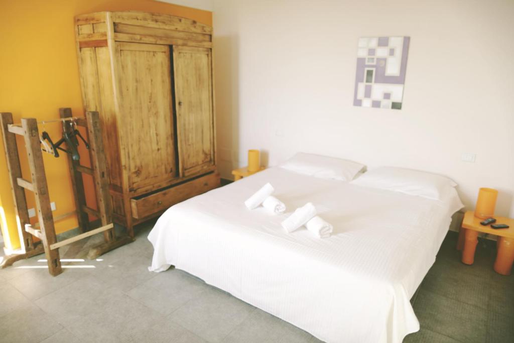 Łóżko lub łóżka w pokoju w obiekcie Agriturismo Beatilla
