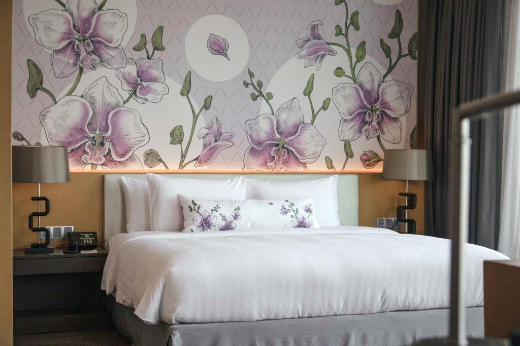 Postel nebo postele na pokoji v ubytování Sivatel Bangkok Hotel