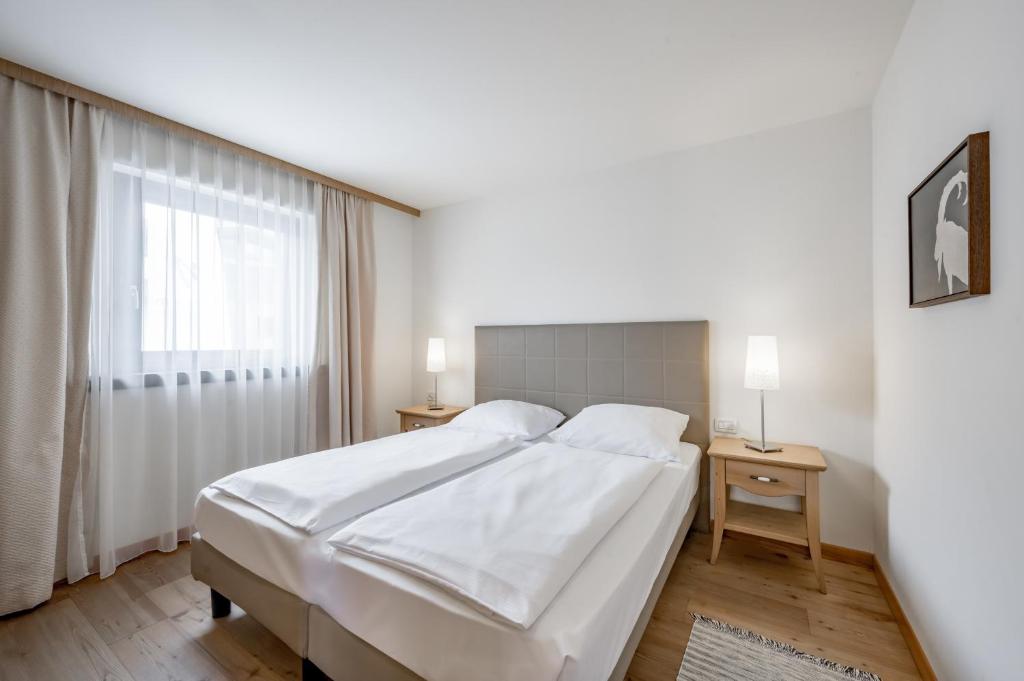 Posteľ alebo postele v izbe v ubytovaní Apartment Torri di Seefeld