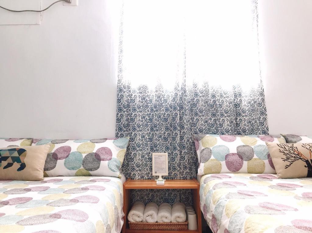 Postel nebo postele na pokoji v ubytování Lazy House