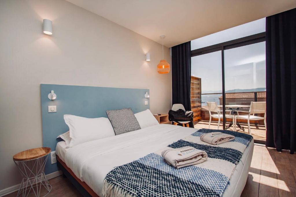 Postel nebo postele na pokoji v ubytování Auberge Kallisté - Eco Label
