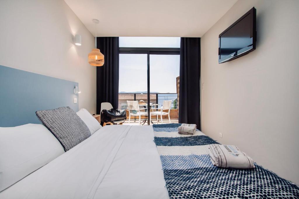Postel nebo postele na pokoji v ubytování Auberge Kallisté - Eco Label
