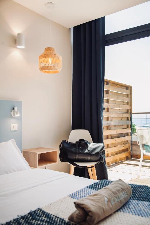 Postel nebo postele na pokoji v ubytování Auberge Kallisté - Eco Label