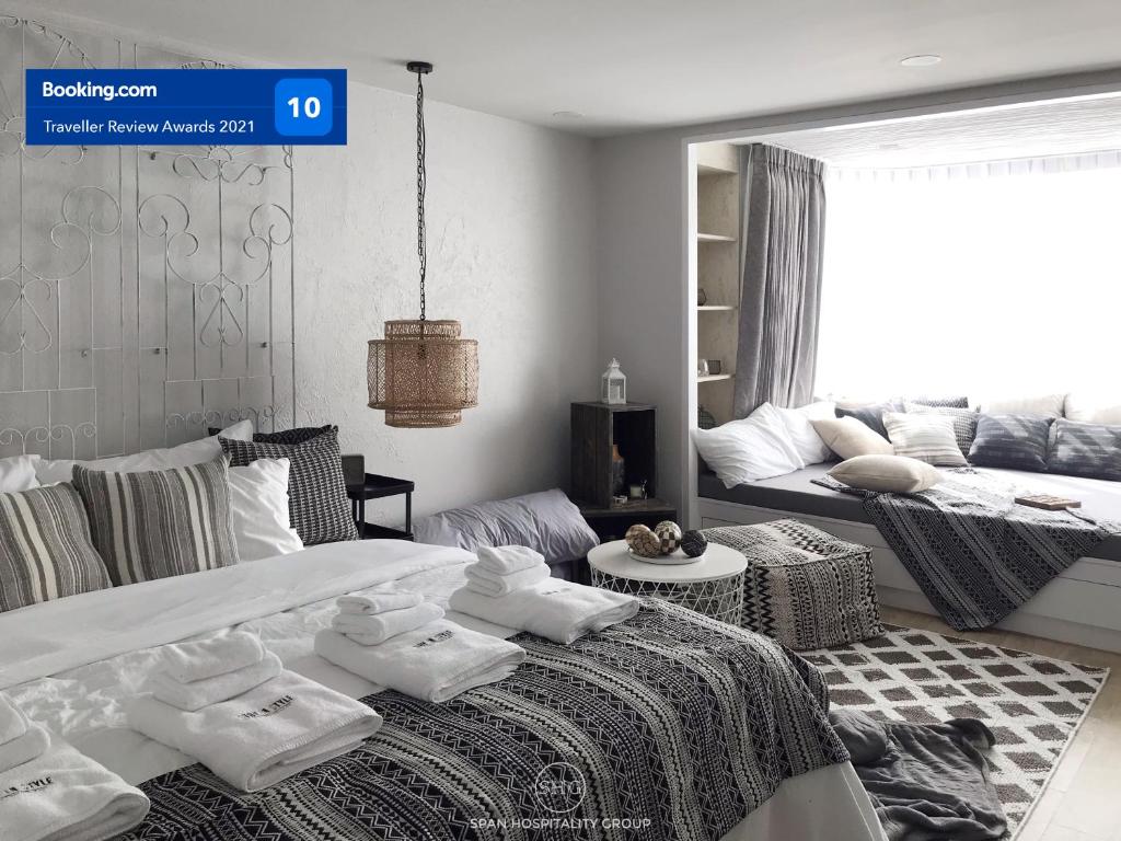 En eller flere senge i et værelse på Stay in Style at Nimman R316