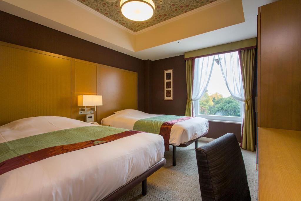 Postel nebo postele na pokoji v ubytování Hotel Monterey Akasaka