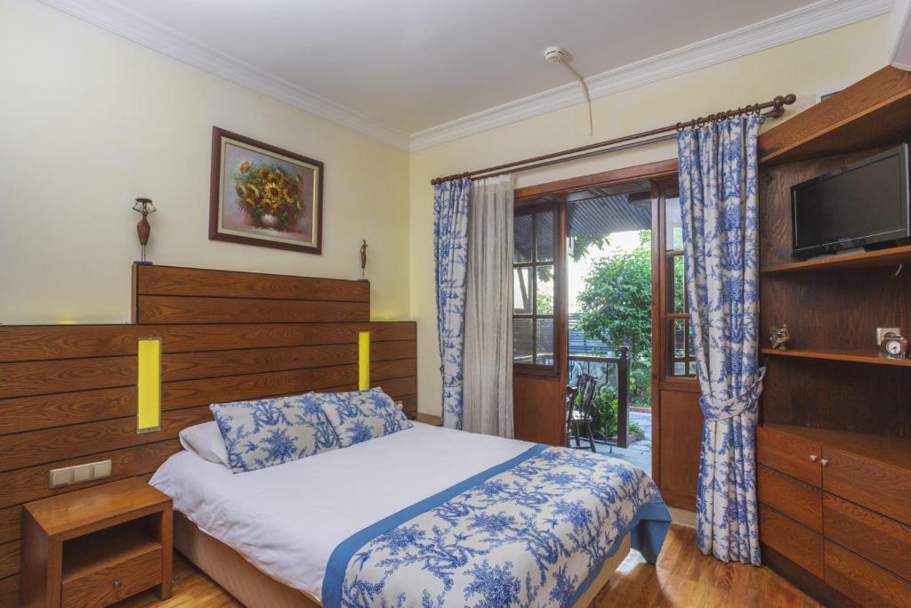 Postel nebo postele na pokoji v ubytování Hotel Villa Daffodil