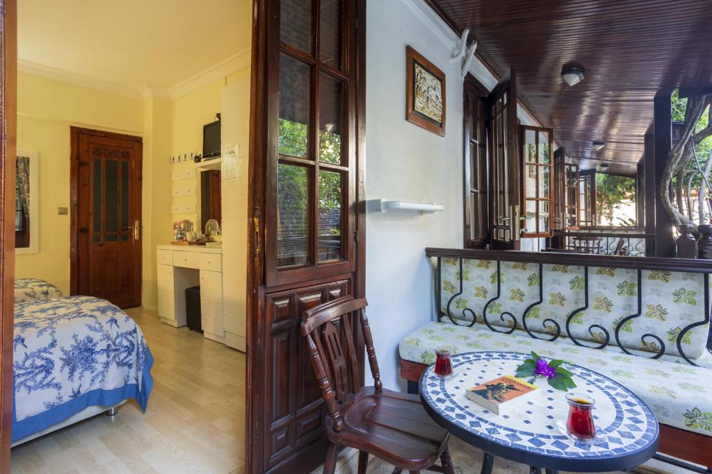 Postel nebo postele na pokoji v ubytování Hotel Villa Daffodil
