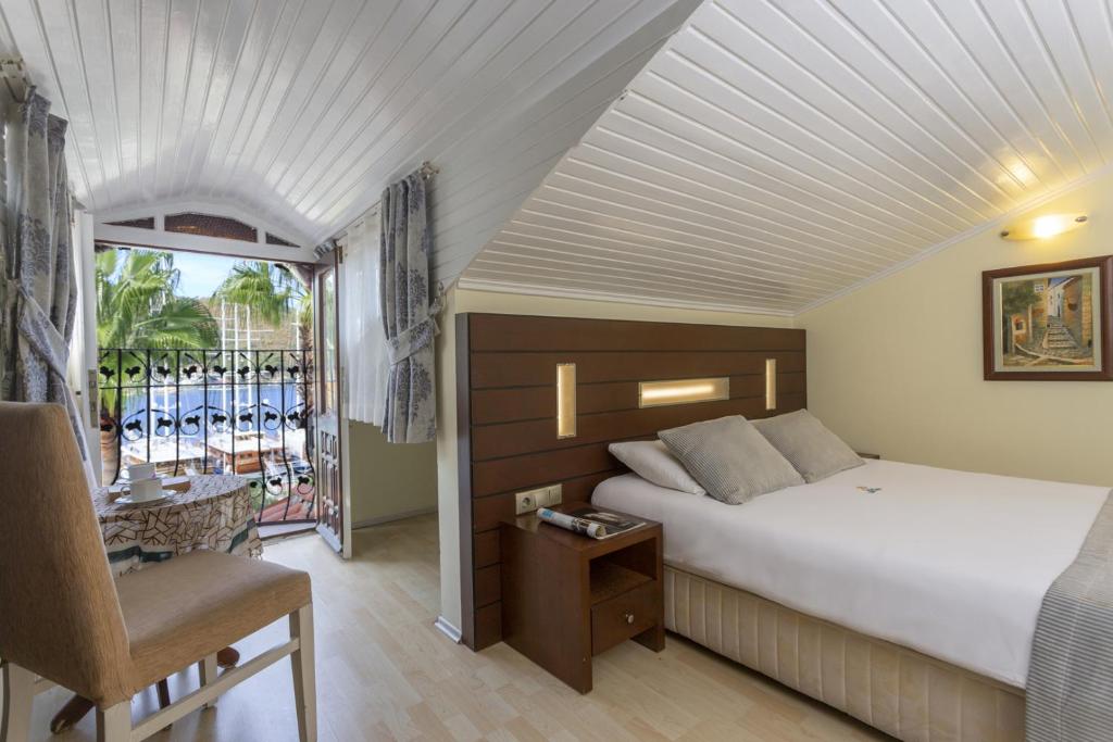 Postel nebo postele na pokoji v ubytování Hotel Villa Daffodil