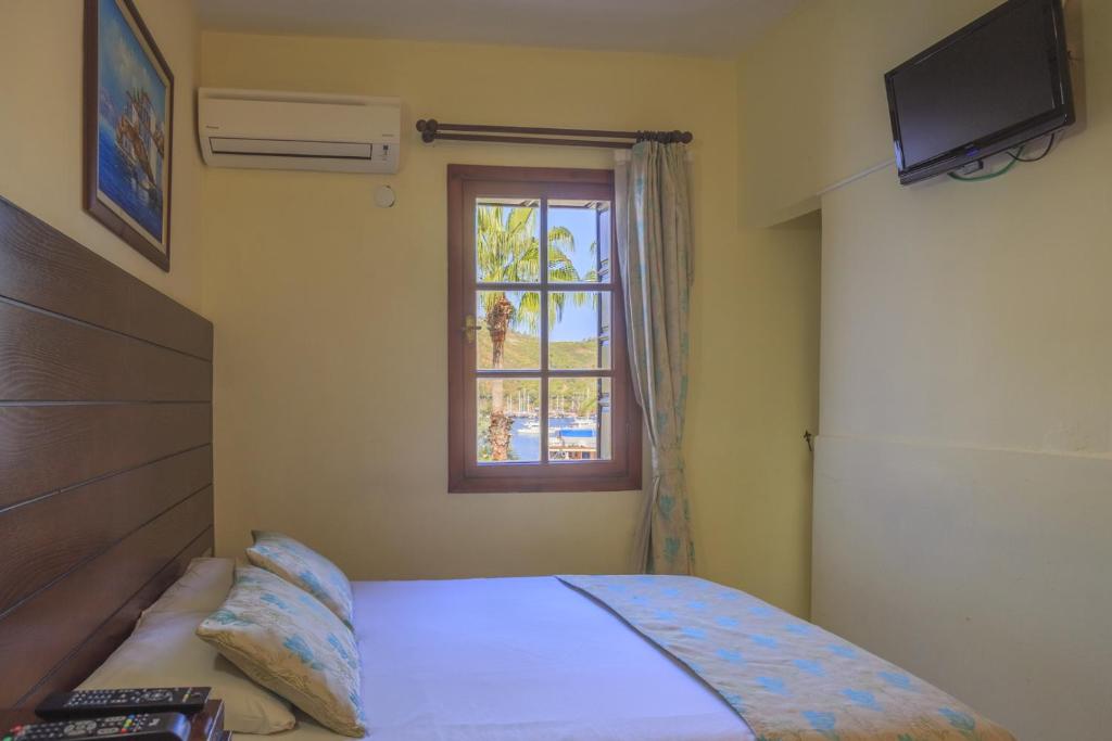 Postel nebo postele na pokoji v ubytování Hotel Villa Daffodil
