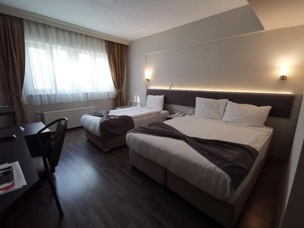 Postel nebo postele na pokoji v ubytování Temizay Hotel