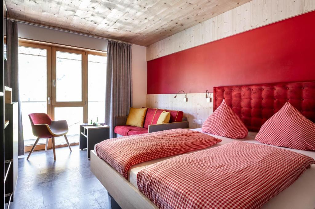 Postel nebo postele na pokoji v ubytování Base Aktivhotel Montafon