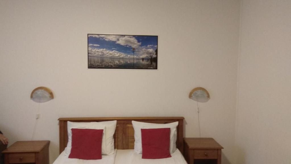 Postel nebo postele na pokoji v ubytování Nádas Pihenőpark