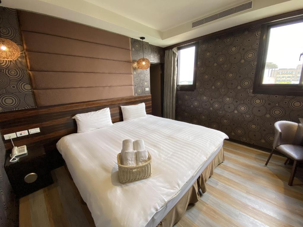 Postel nebo postele na pokoji v ubytování IN99 Hotel