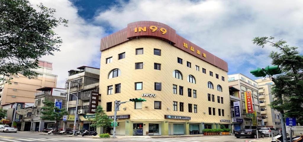 a building with a sign on the top of it at IN99 Hotel in Jincheng