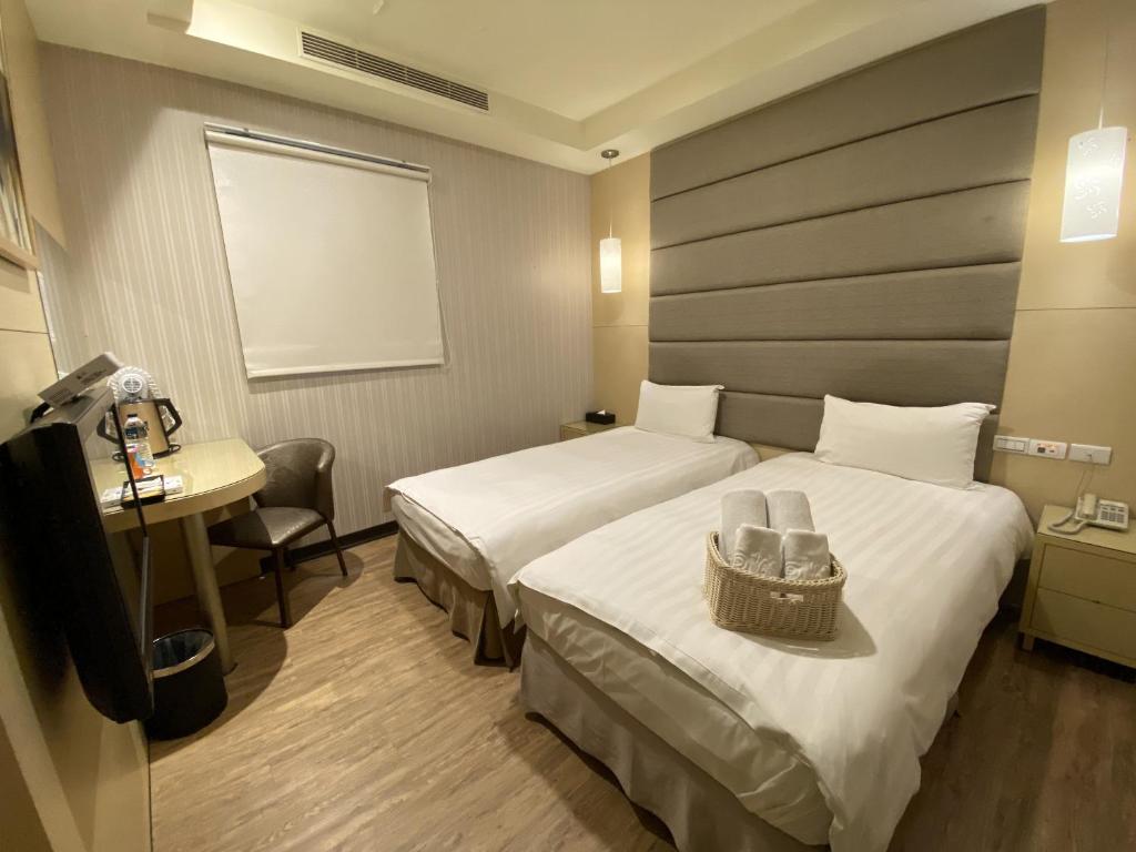 Postel nebo postele na pokoji v ubytování IN99 Hotel