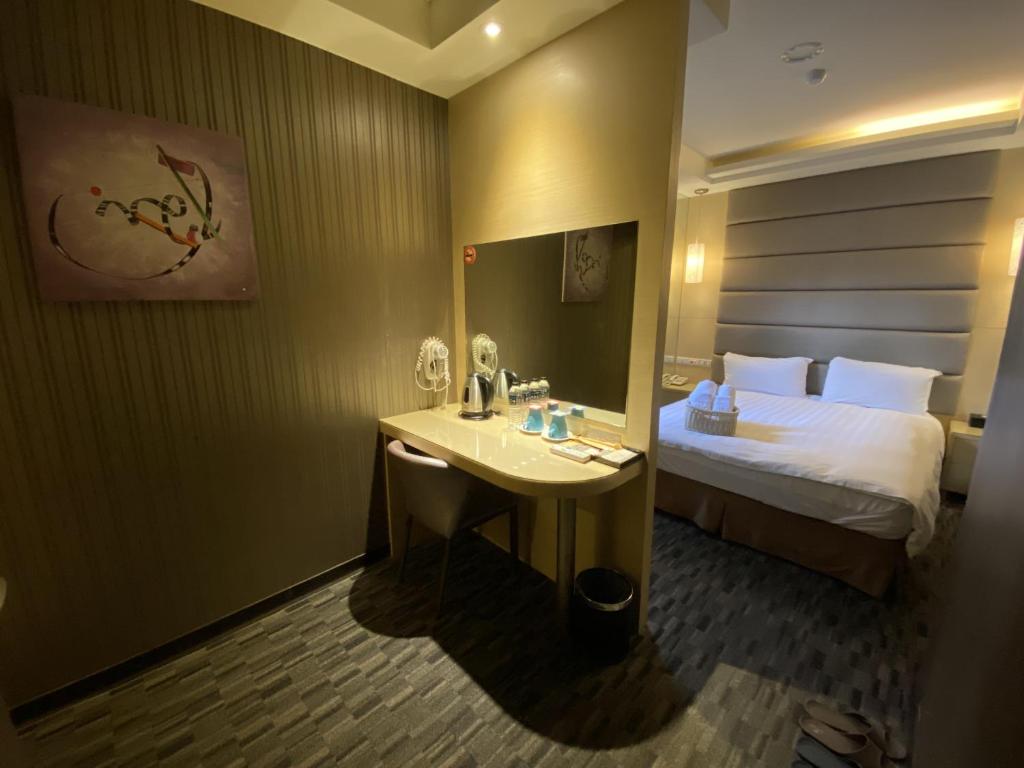 Postel nebo postele na pokoji v ubytování IN99 Hotel