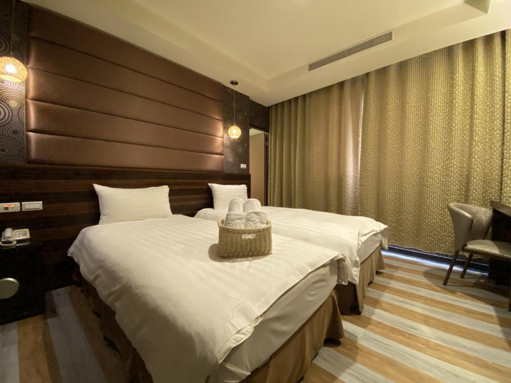 Postel nebo postele na pokoji v ubytování IN99 Hotel