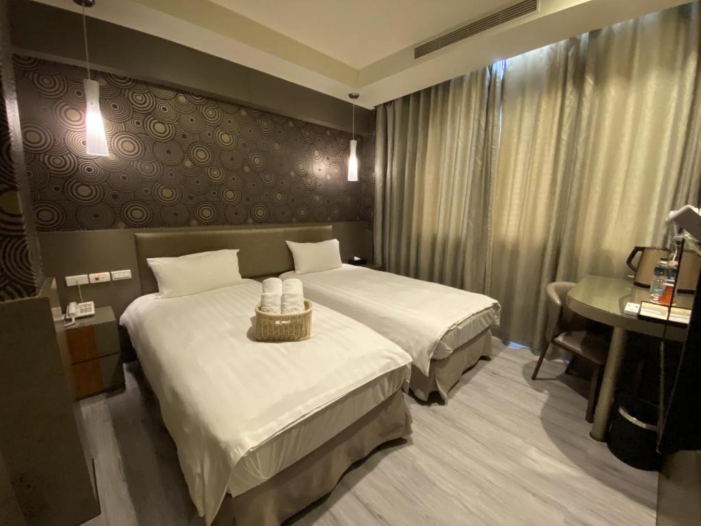 Postel nebo postele na pokoji v ubytování IN99 Hotel