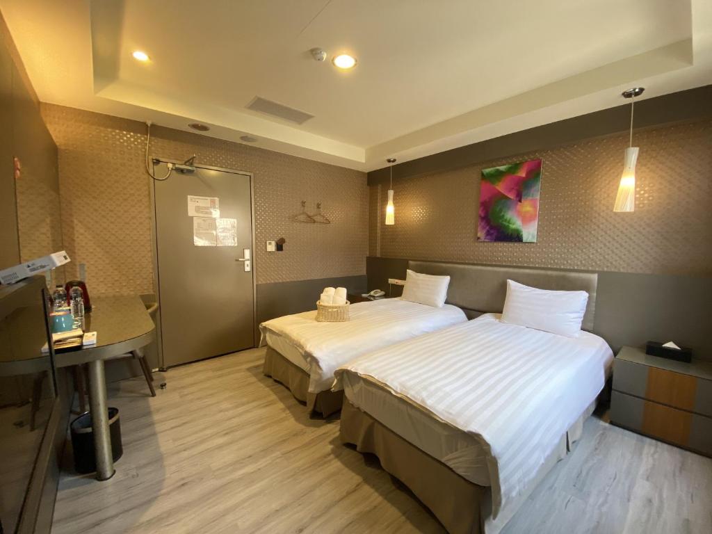 Postel nebo postele na pokoji v ubytování IN99 Hotel