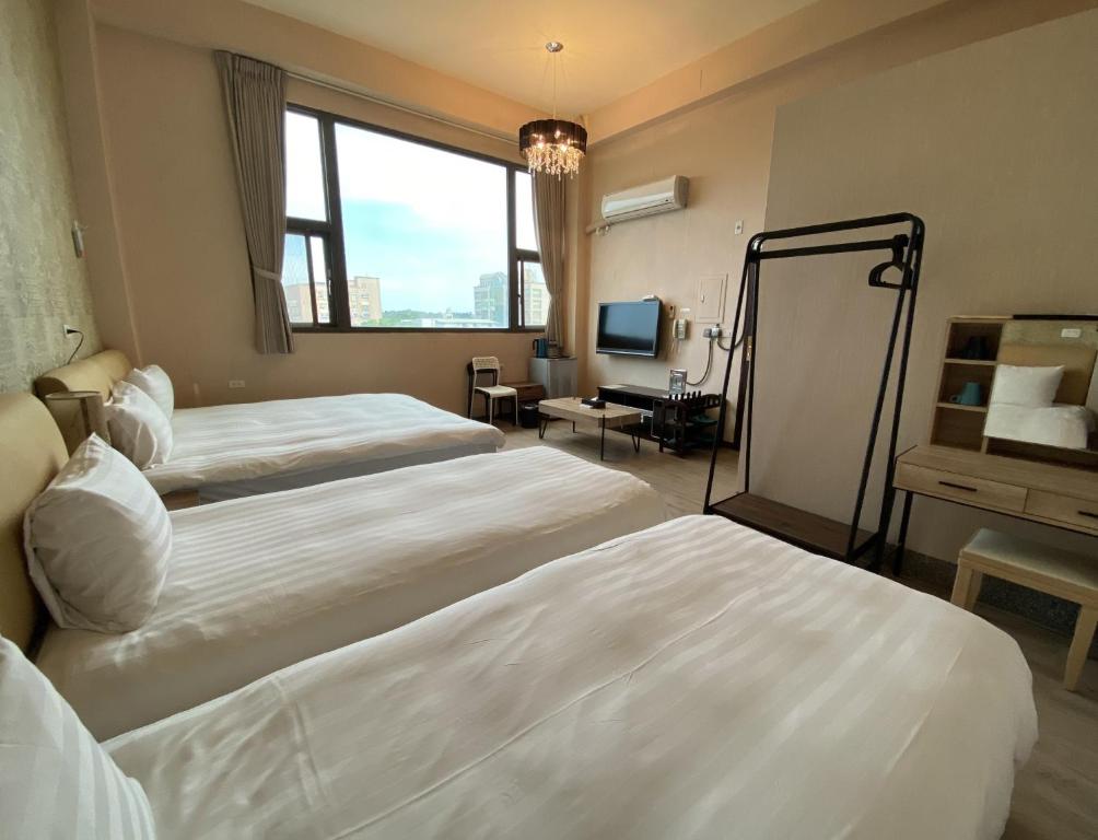 Postel nebo postele na pokoji v ubytování IN99 Hotel