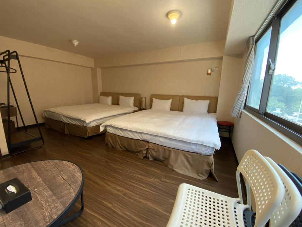 Postel nebo postele na pokoji v ubytování IN99 Hotel