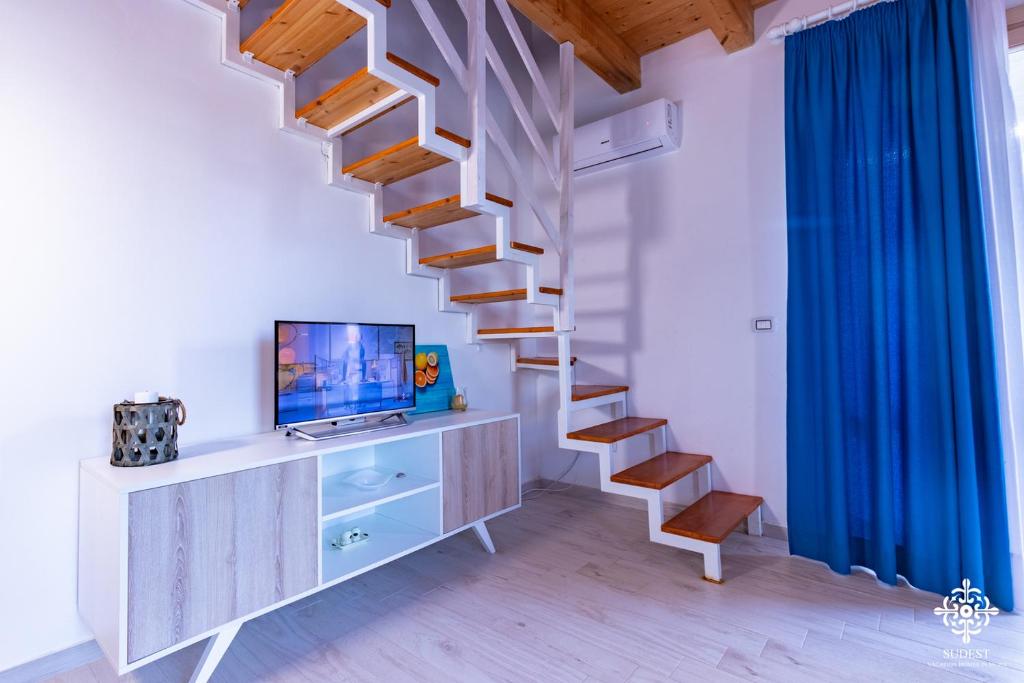 TV a/nebo společenská místnost v ubytování Beach Front Villas