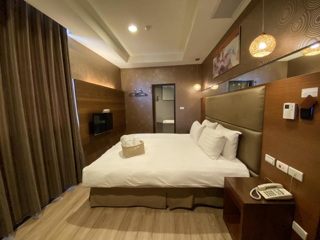 Postel nebo postele na pokoji v ubytování IN99 Hotel