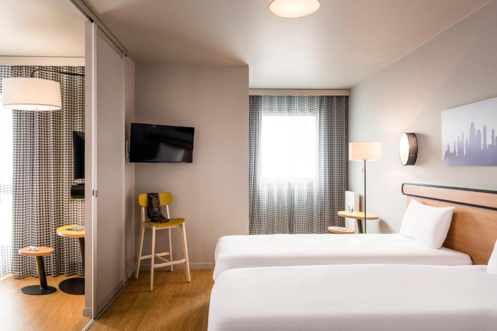 Postel nebo postele na pokoji v ubytování Adagio Access Stuttgart Airport Messe